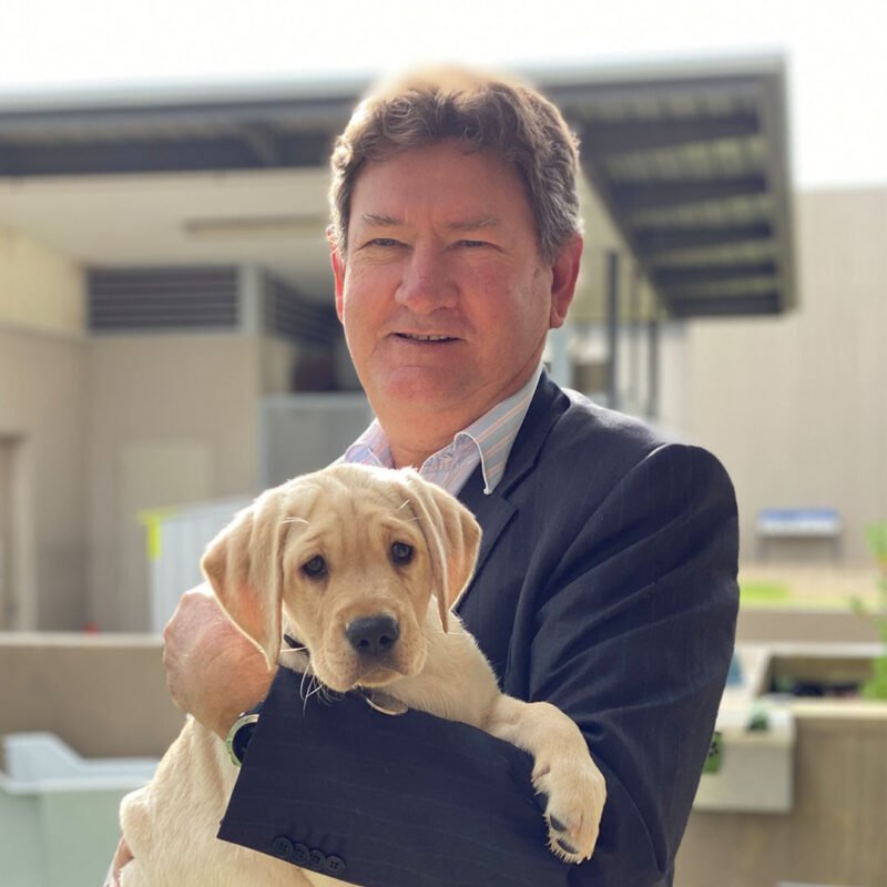 Tim holding a puppy